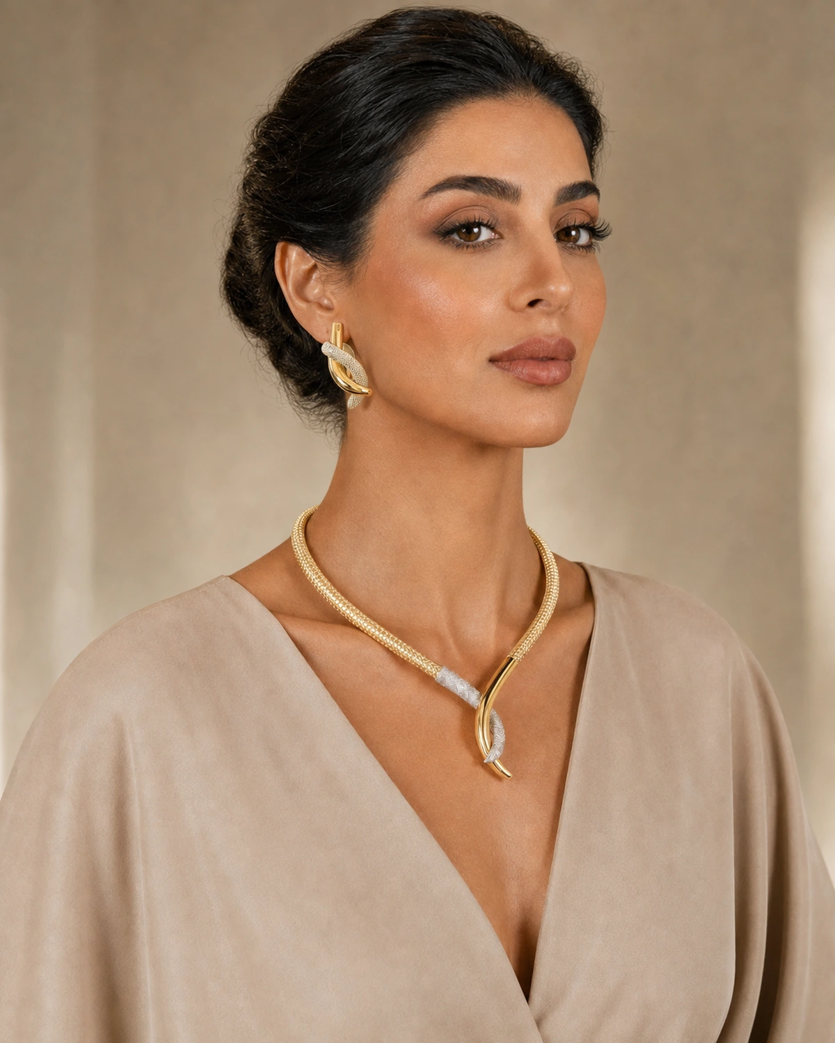 Model wearing the complete Aurelia jewellery set in warm architectural light.