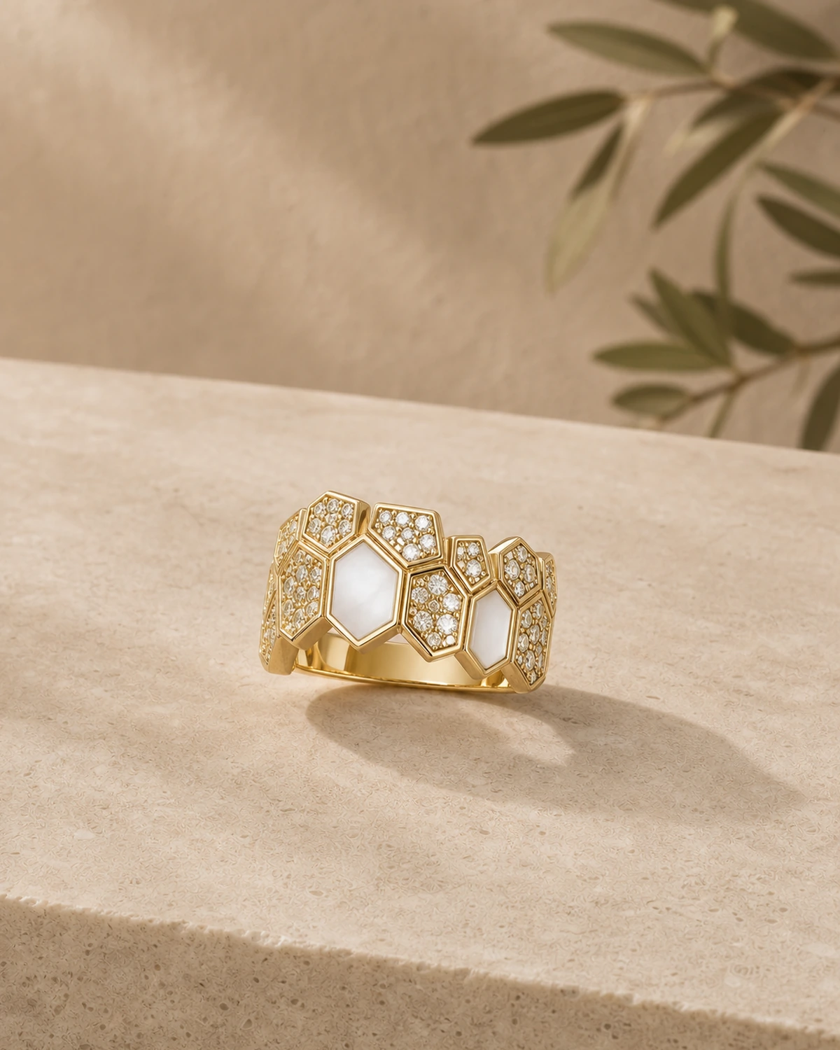 Close catalogue view of Lucilla's compact clustered polygon ring with alternating pale and densely textured faces.
