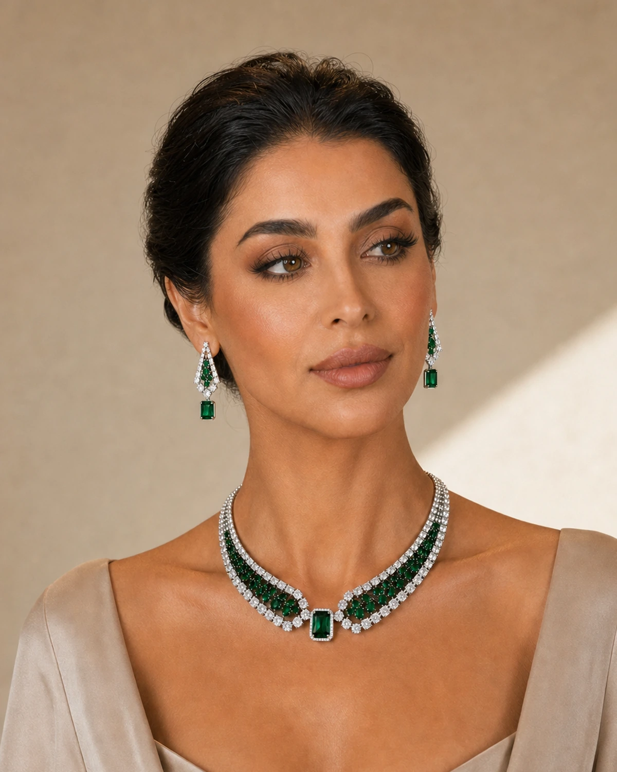 Model wearing the complete Valeria jewellery set in warm architectural light.