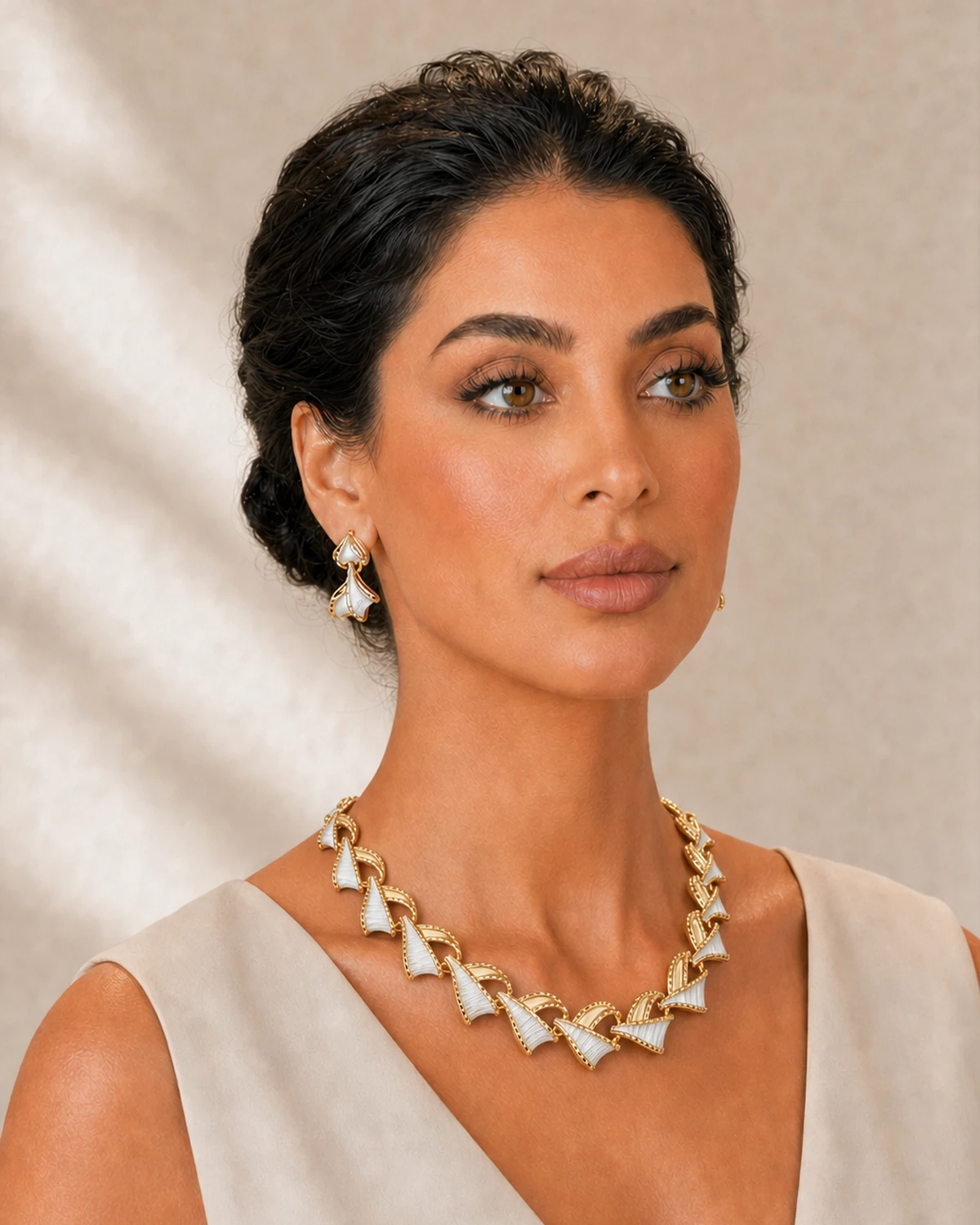 Three-quarter portrait of Luna wearing the complete Vesper necklace and nearest matching two-tier earring in the same studio session.